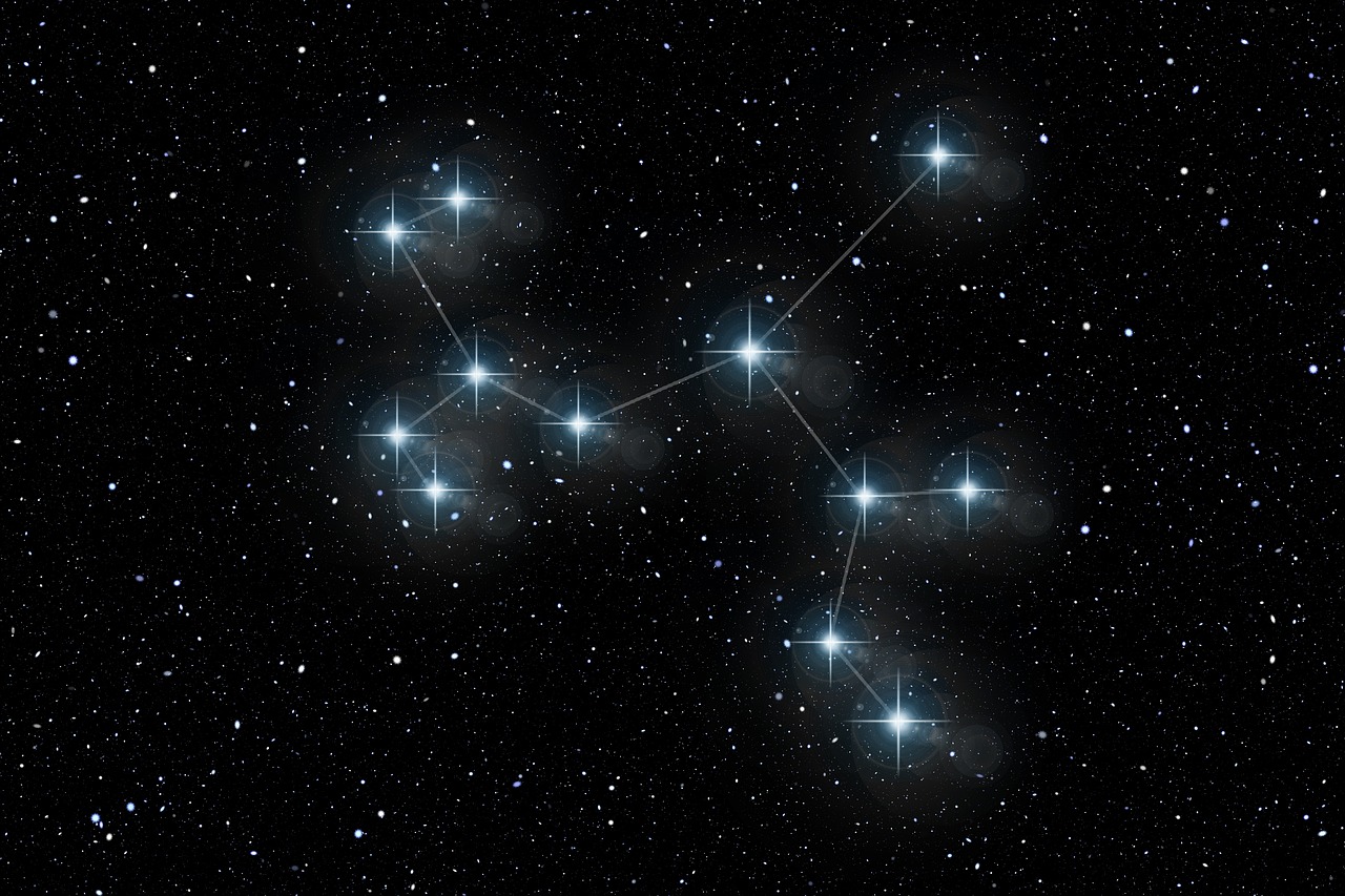 A field of stars above a dark horizon.